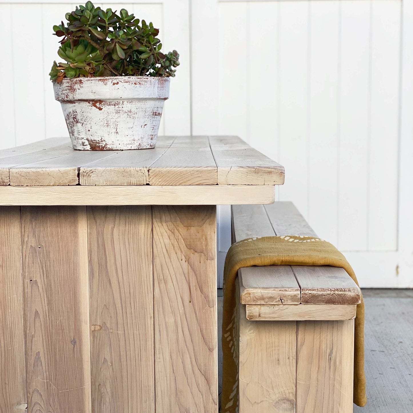 wood picnic table with planked top and two benches
