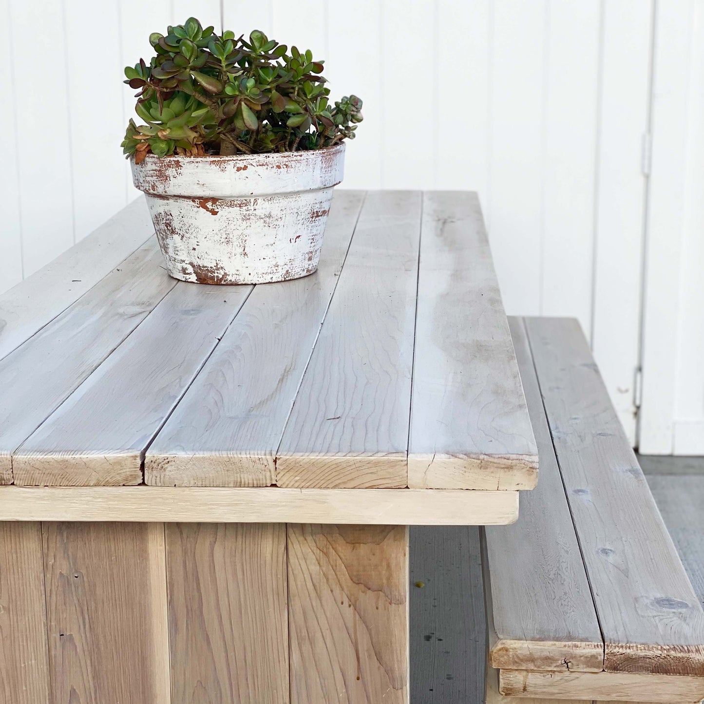wood picnic table with planked top and two benches