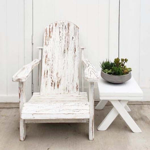 white painted distressed outdoor lounge chair