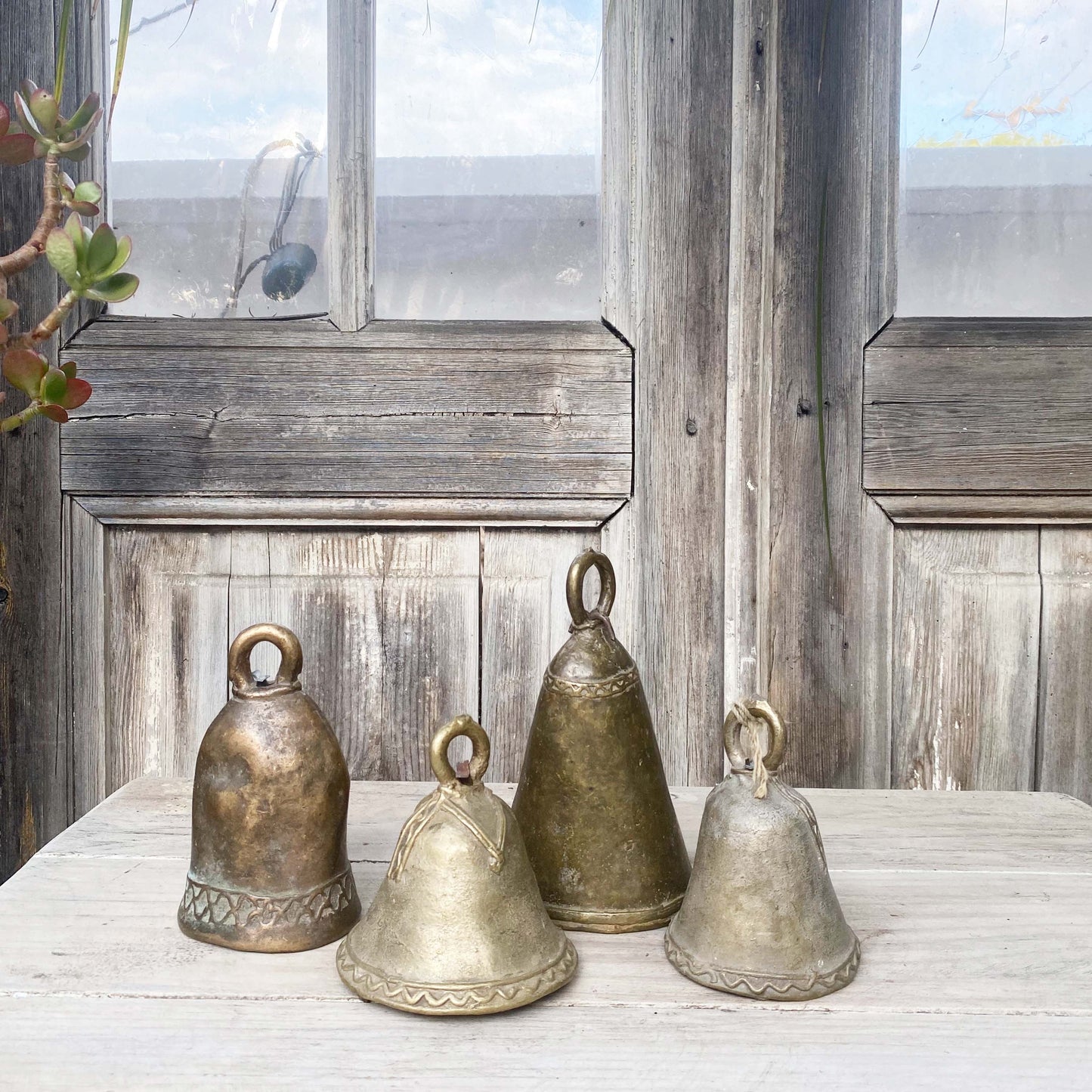 brass hand held dinner bells in varying sizes and finishes