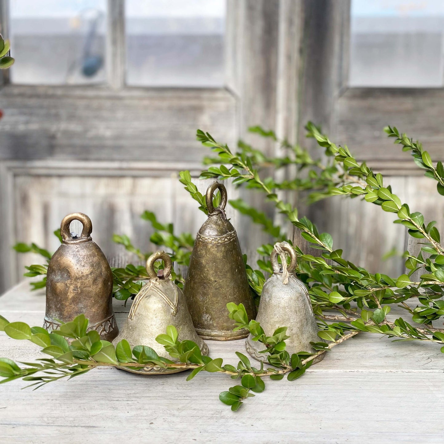 brass hand held dinner bells in varying sizes and finishes