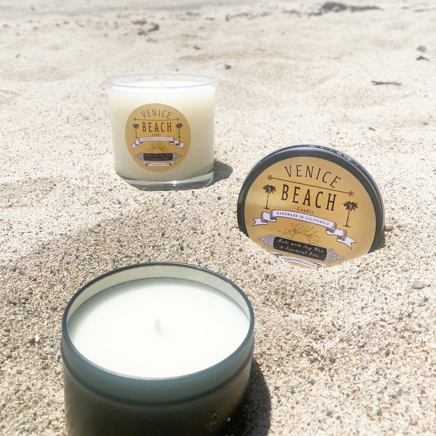 Black travel candle tin with Venice Beach logo on lid
