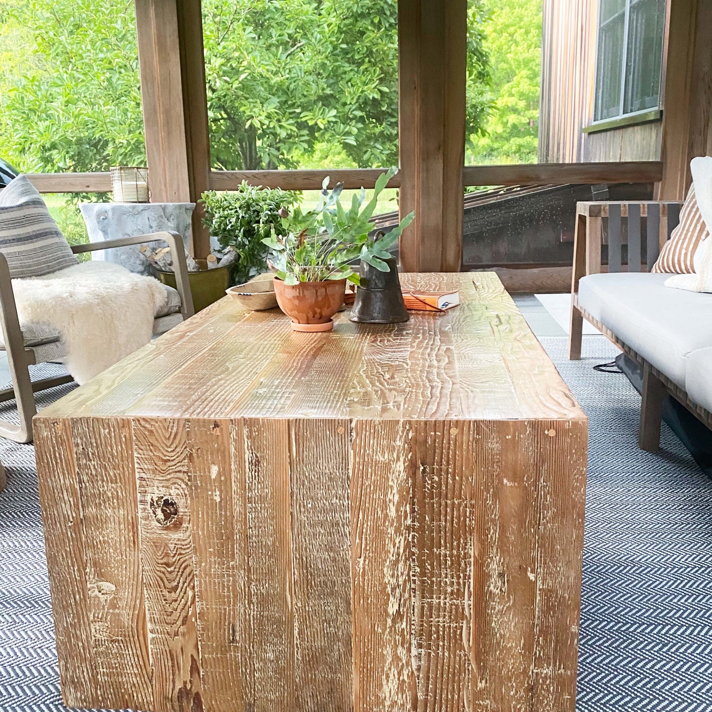 wood coffee table made of repurposed wood stained in medium brown color, open underneath...