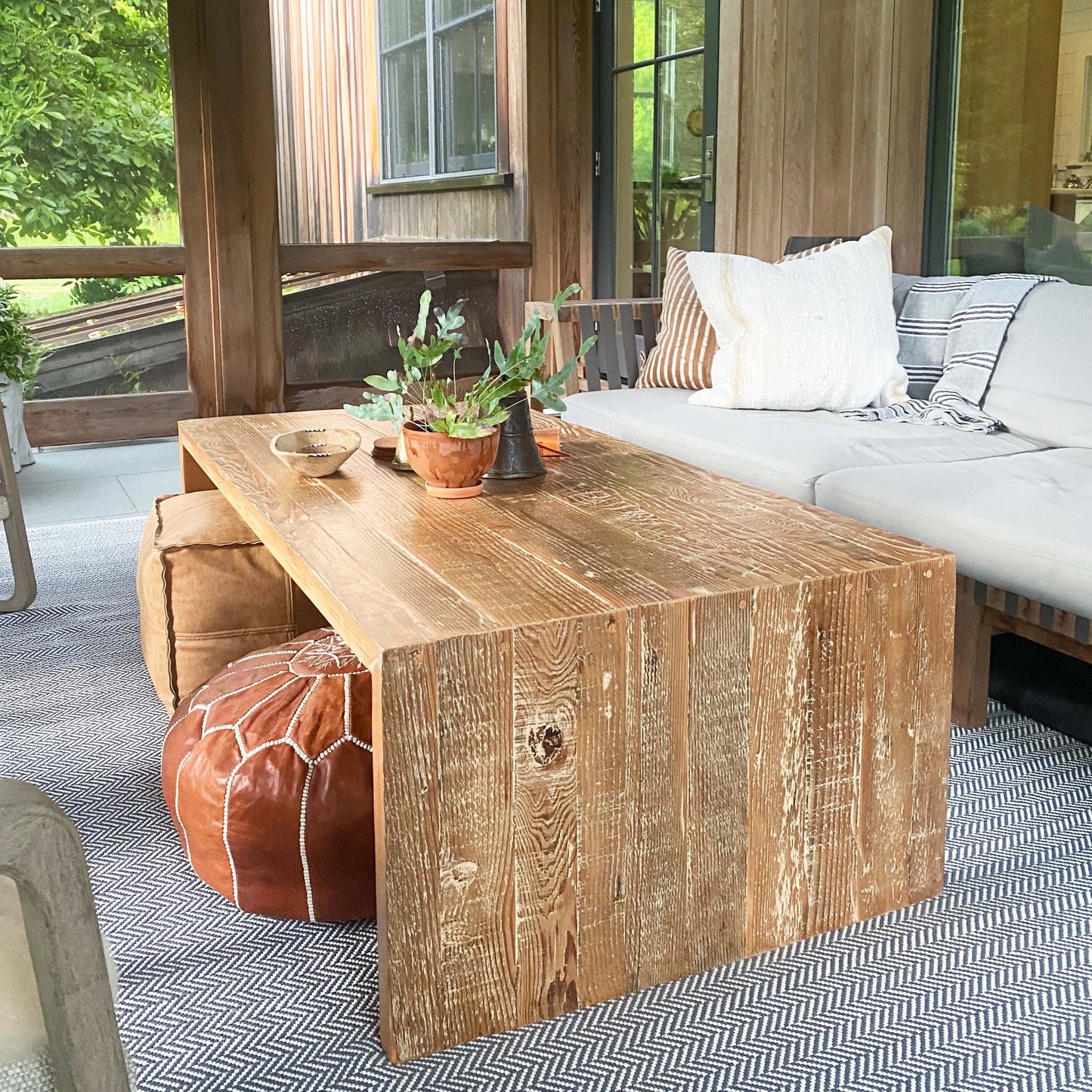 wood coffee table made of repurposed wood stained in medium brown color, open underneath...