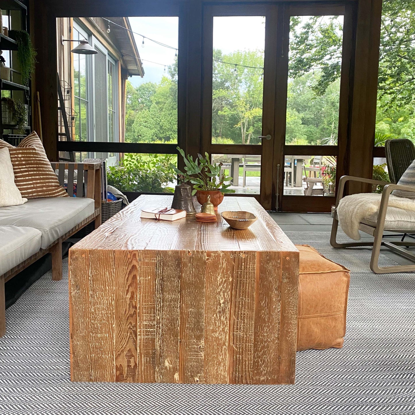 wood coffee table made of repurposed wood stained in medium brown color, open underneath...