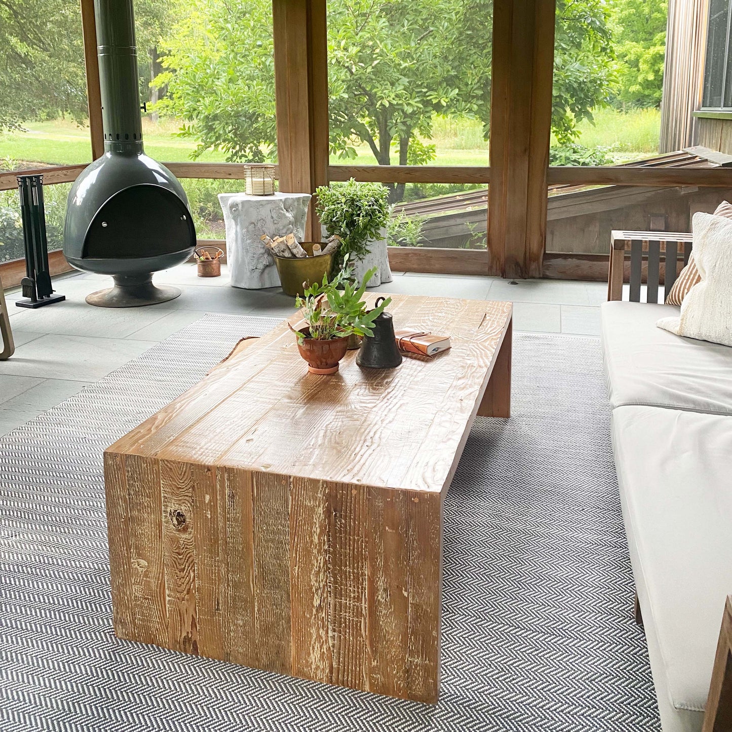 wood coffee table made of repurposed wood stained in medium brown color, open underneath...
