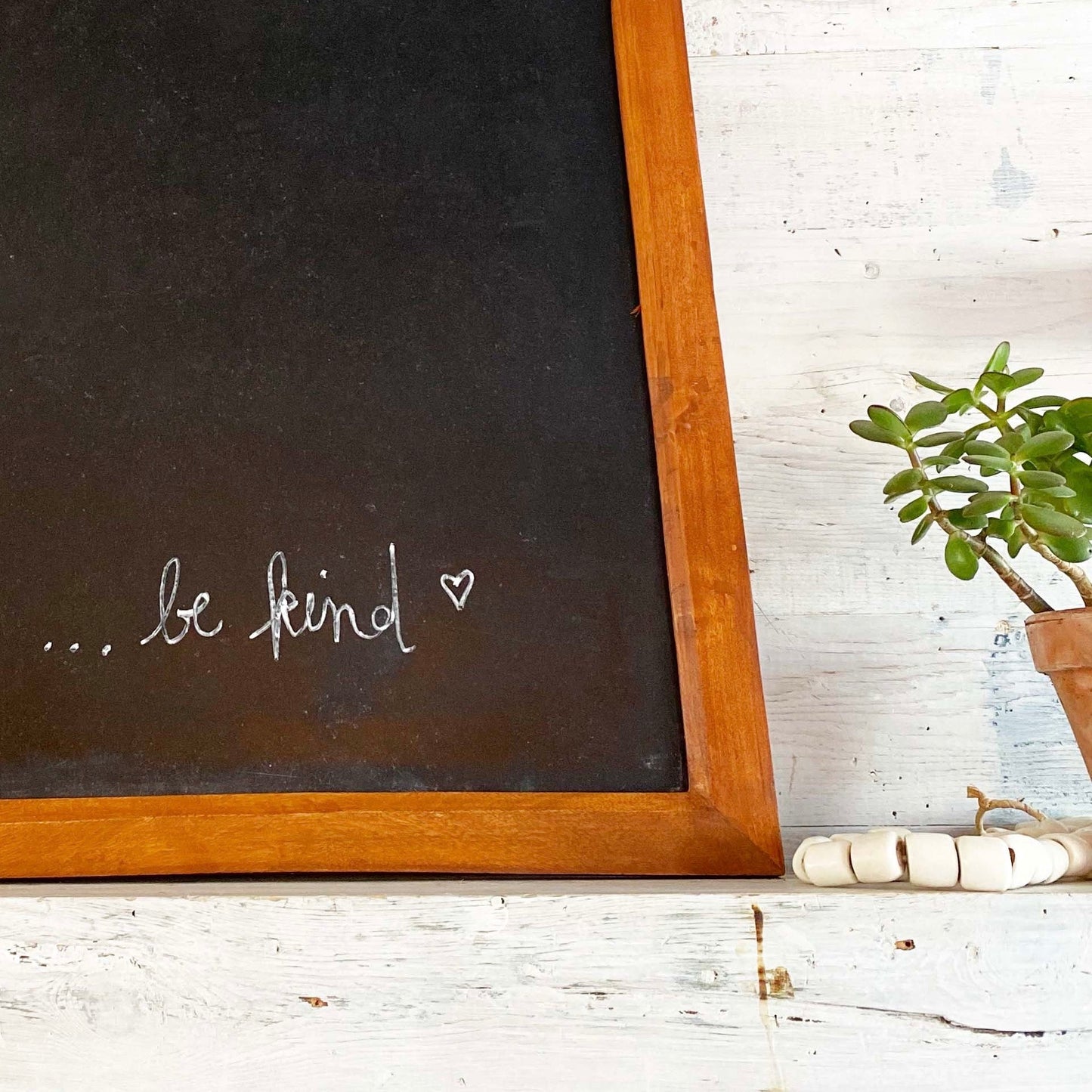rectangular chalkboard with brown wood frame