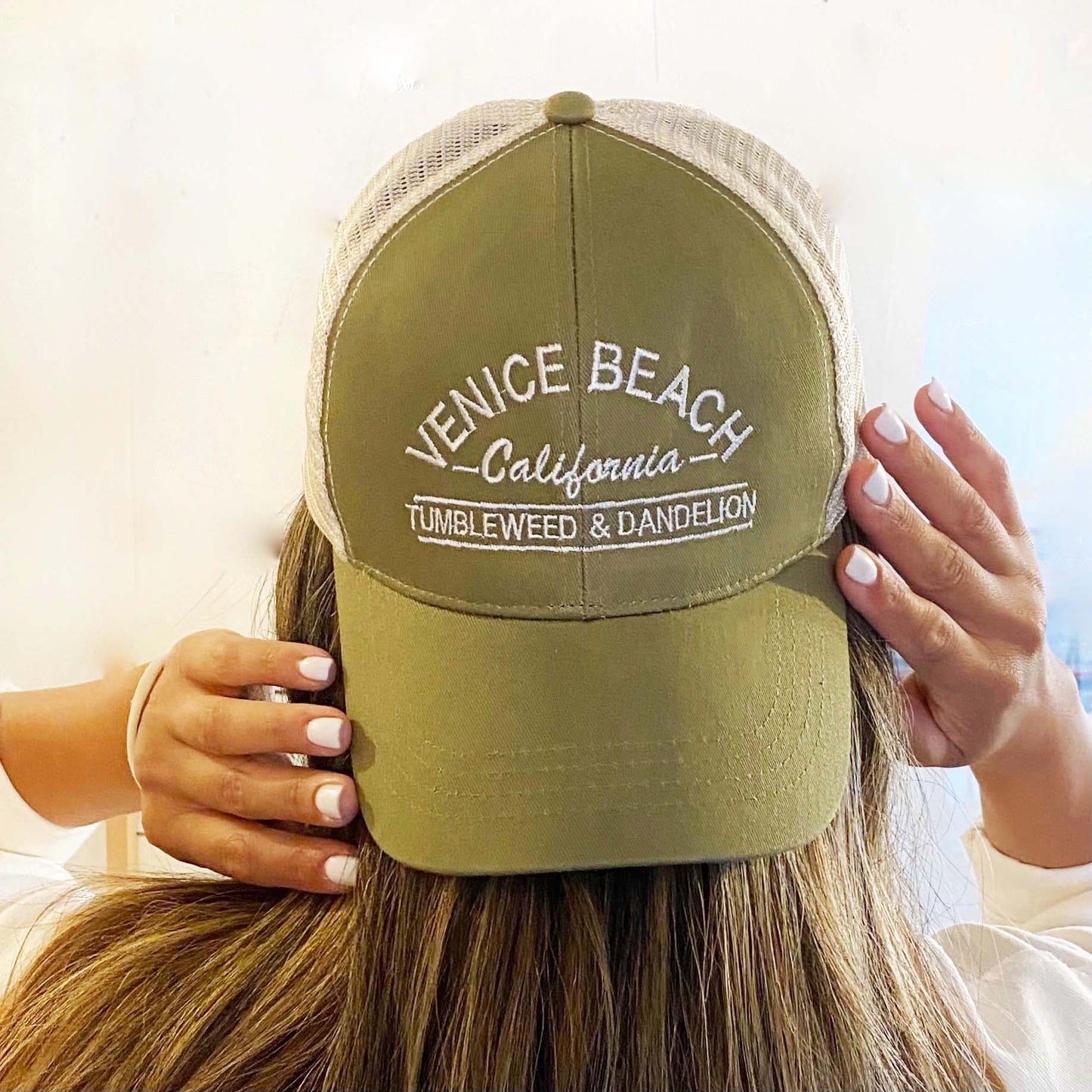 olive green and tan trucker cap with adjustable strap