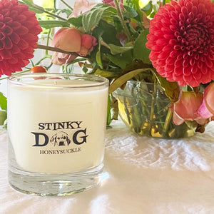 STINKY DOG logo on clear glass candle