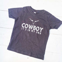 Load image into Gallery viewer, dark blue youth tee shirt with words Cowboy it&#39;s in my DNA in white on the front