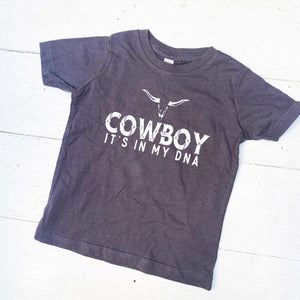 dark blue youth tee shirt with words Cowboy it's in my DNA in white on the front