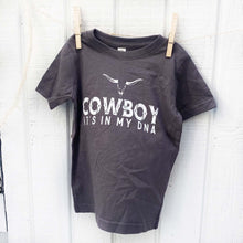 Load image into Gallery viewer, dark blue youth tee shirt with words Cowboy it&#39;s in my DNA in white on the front