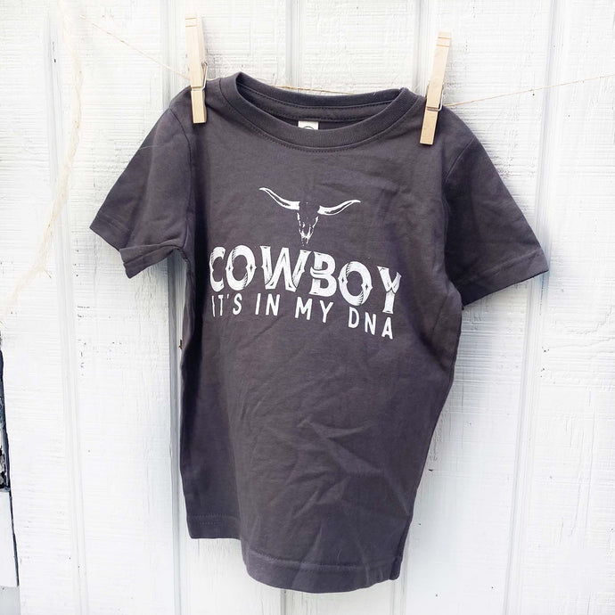 dark blue youth tee shirt with words Cowboy it's in my DNA in white on the front