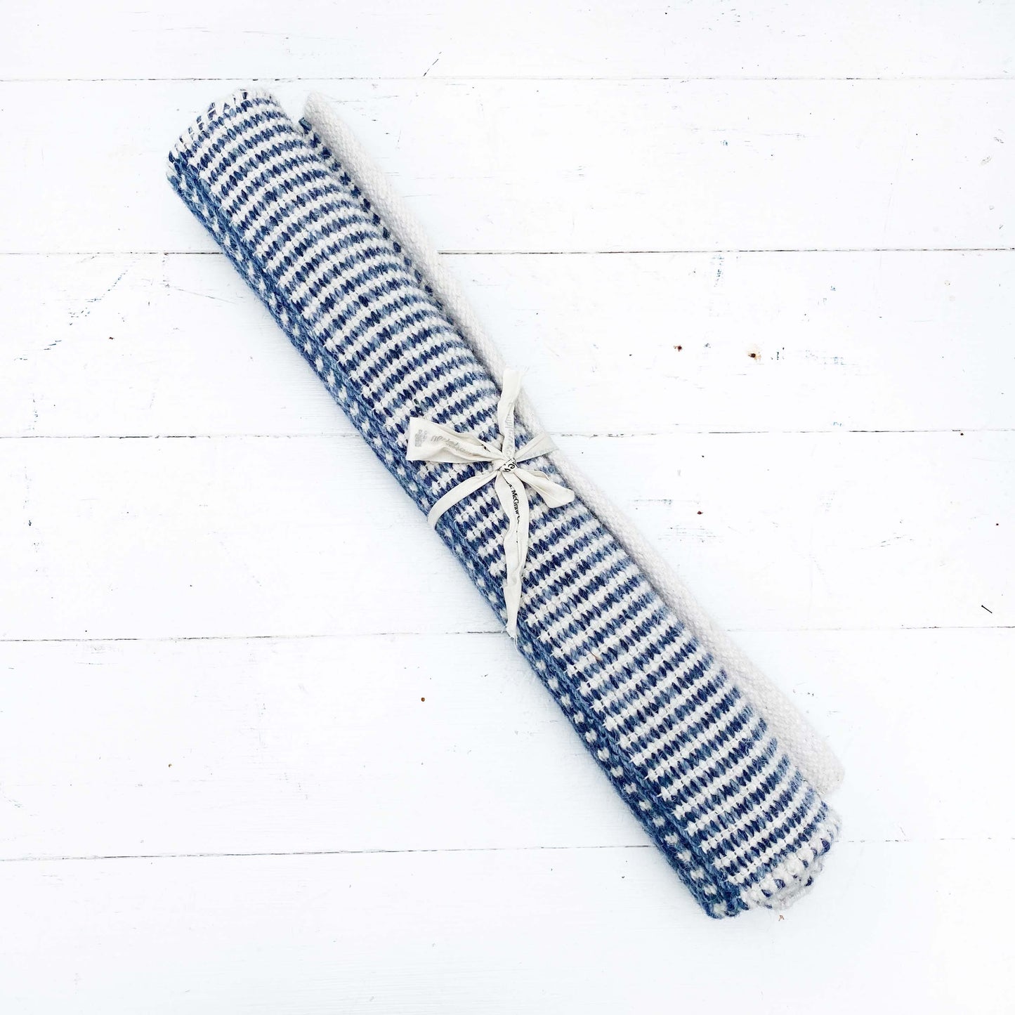 navy rug with white stripes