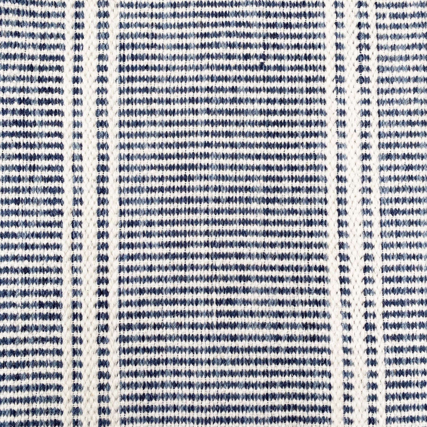 navy rug with white stripes