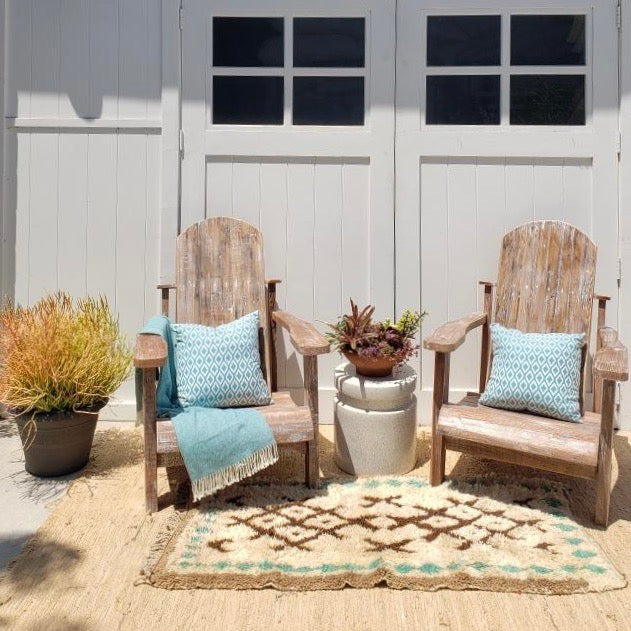 wood outdoor chairs aged with small areas of white paint