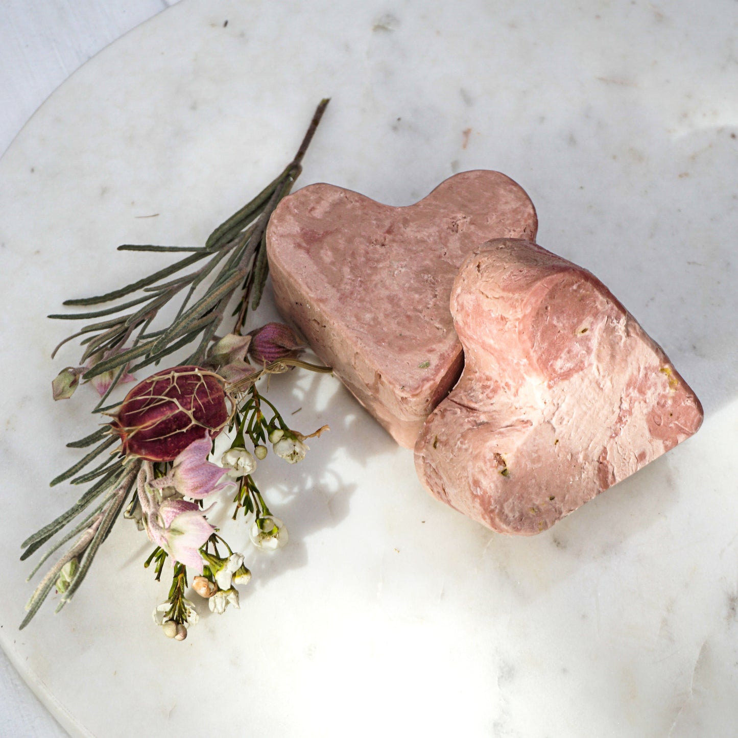 rose colored clay heart shaped soap