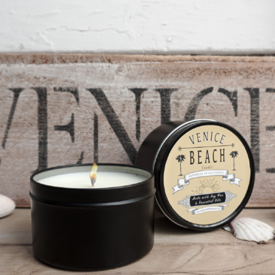 Black travel candle tin with Venice Beach logo on lid