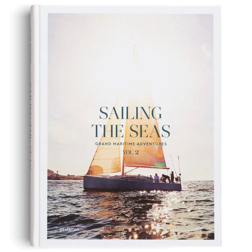 Book cover of 'Sailing the Seas' with a sailboat on the water