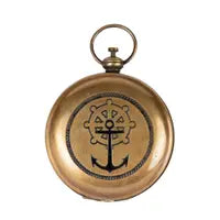 round brass pocket compass with anchor on cover