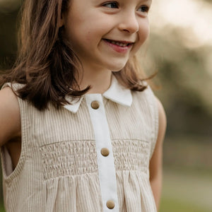 beige pinstripe kid's sleeveless dress with front snaps