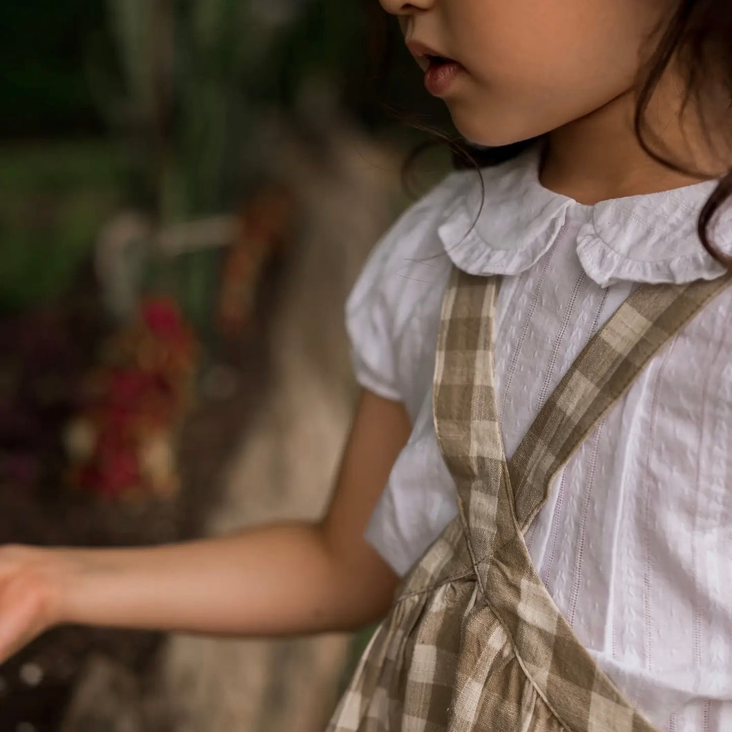 white kid's short sleeved blouse with collar