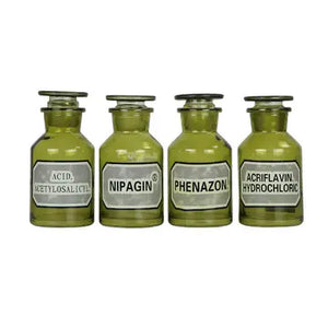 Set of green apothecary jars with lids with vintage inspired labels