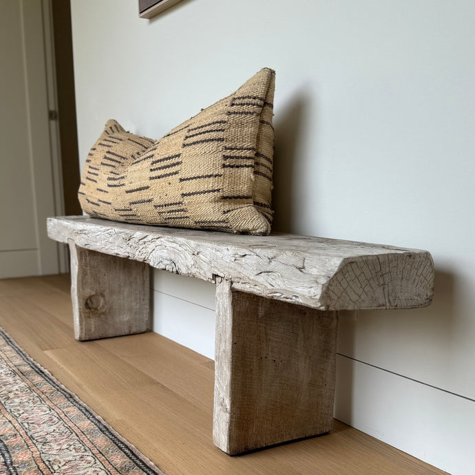 Rustic wood bench with thick slabs of distressed wood