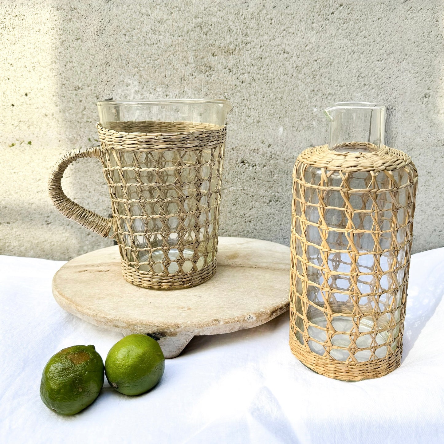 Glassware encased in seagrass