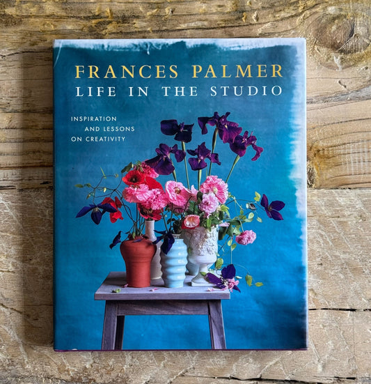 Book cover of 'Life in the Studio' by Frances Palmer on a wooden surface