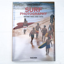 Load image into Gallery viewer, cover of surfing book &quot;Surf Photography of the 1960&#39;s and 1970&#39;s&quot; with a vintage photo  of several men at beach carrying surf boards