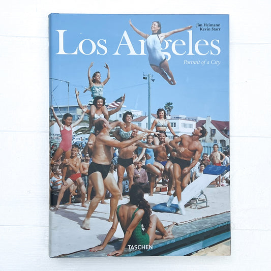 cover of book called "Los Angeles-portrait of a City", with a photo from the 1950's of a group of people at the beach practicing acrobatics