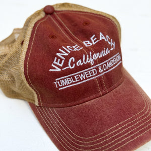 red youth cap with tan back mesh and Venice Beach California Tumbleweed & Dandelion embroidered on front