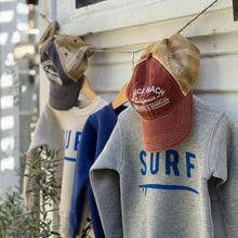 Load image into Gallery viewer, gray, blue and off white toddler sweatshirts with word SURF on front, and a blue and a red youth Venice Beach trucker cap