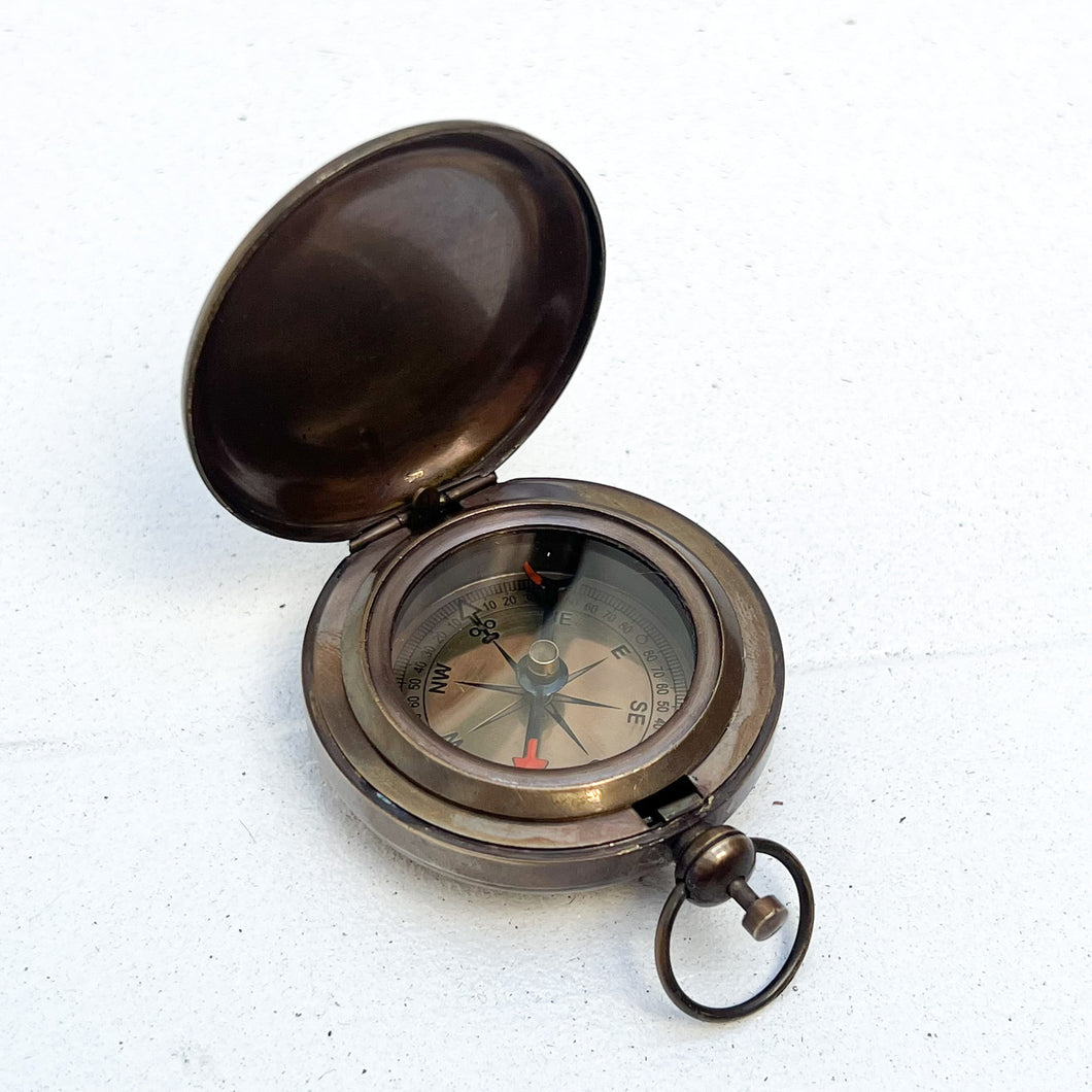round brass pocket compass 