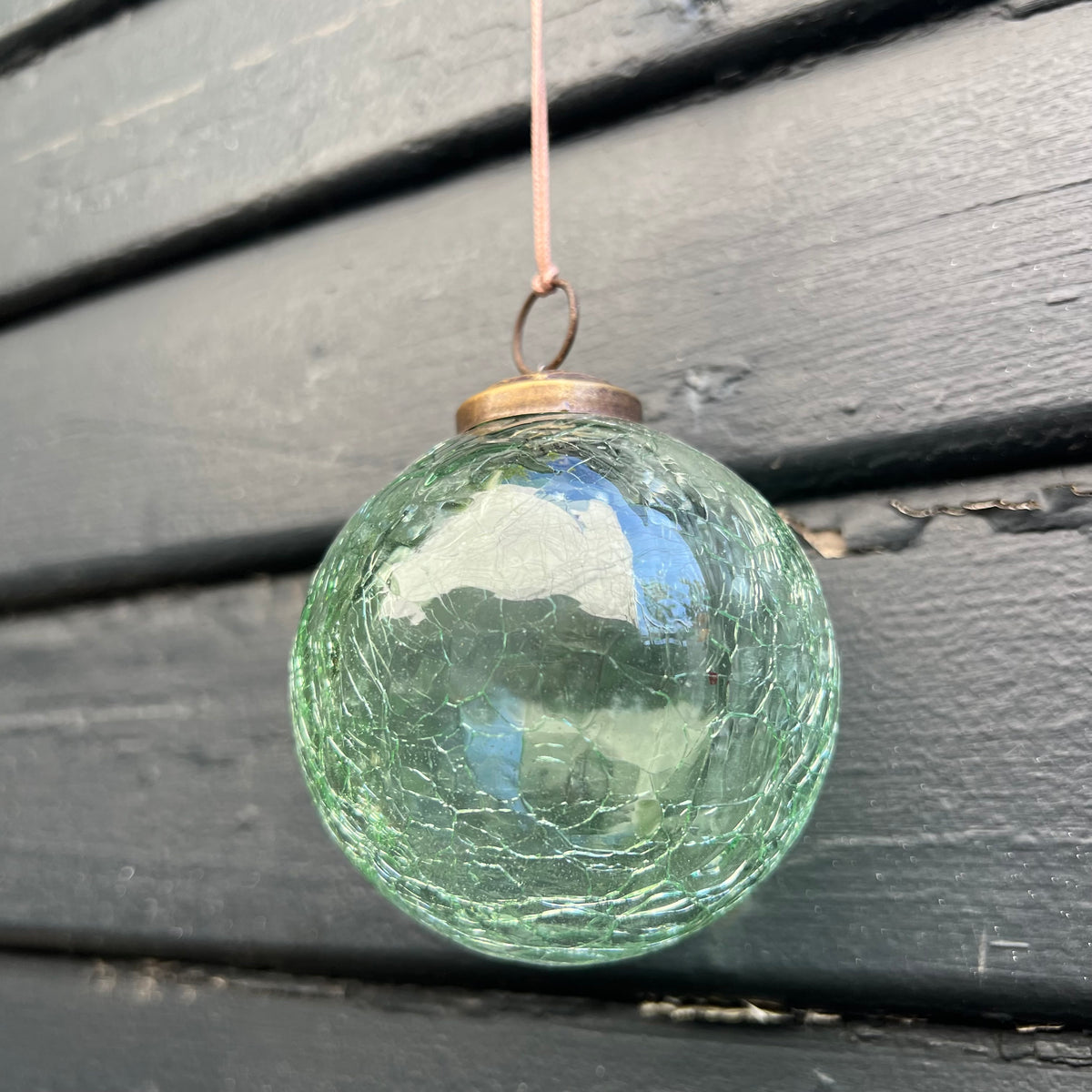 green crackle glass ornament ball with aged brass top
