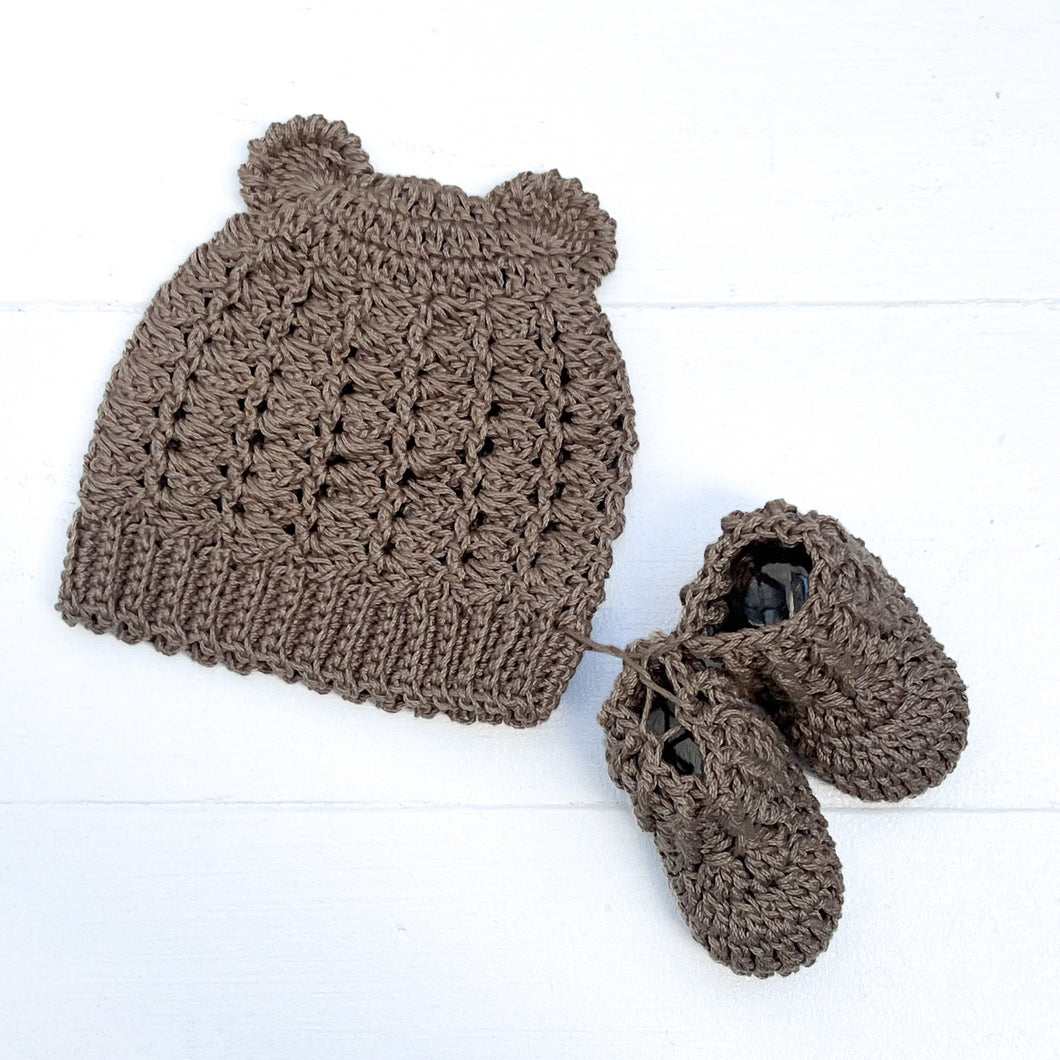 brown hand knit baby hat with small ears and booties