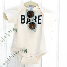 Load image into Gallery viewer, off white baby onesie with BABE in black on front