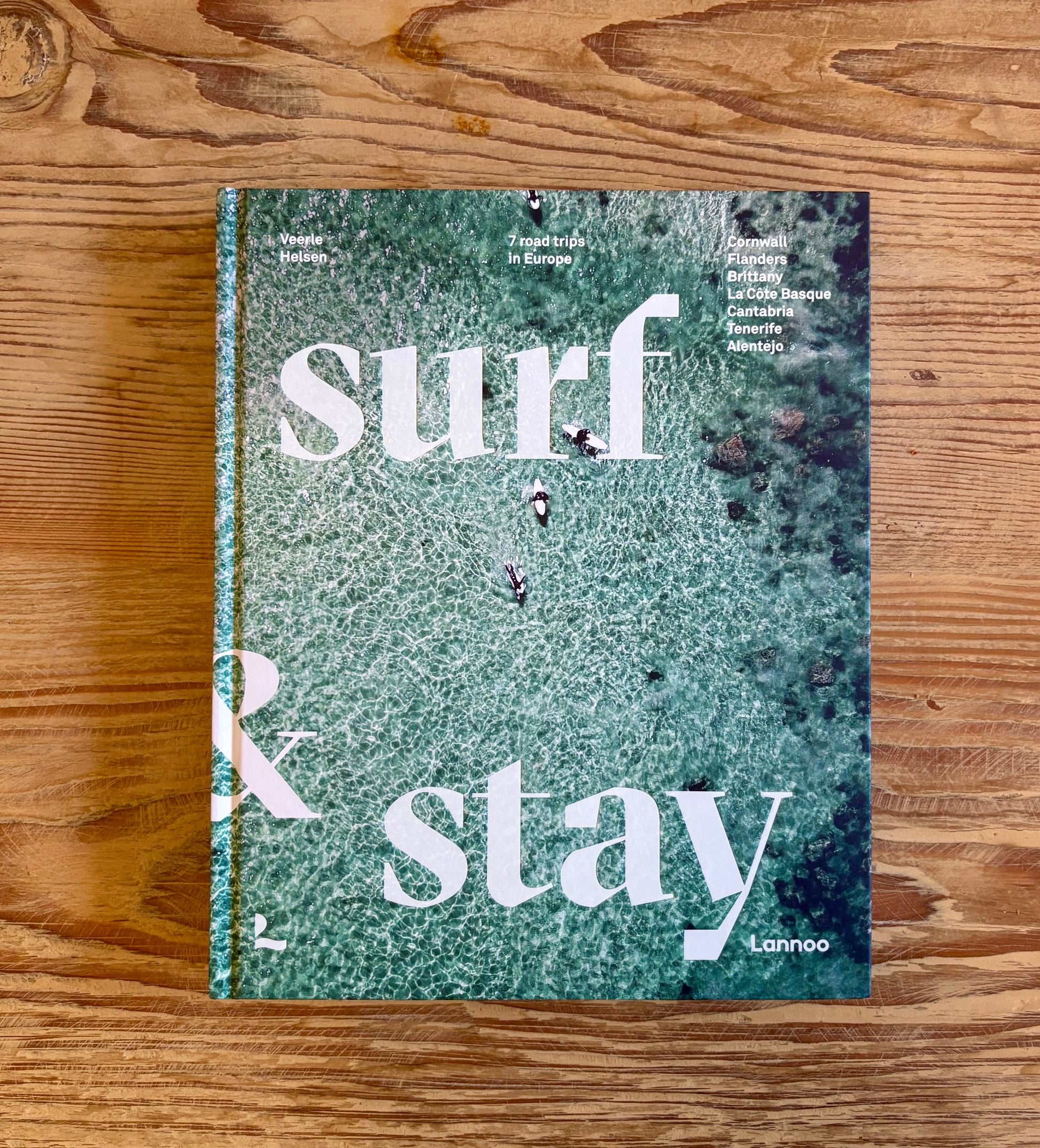 cover of book with ocean background and words "Surf&Stay"