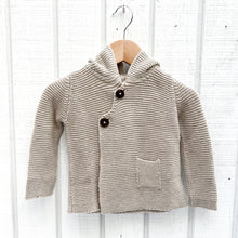 Load image into Gallery viewer, oatmeal colored baby sweater with hood and two black buttons and one small pocket