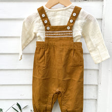 Load image into Gallery viewer, ochre colored corduroy baby overalls with cream buttons and cream stitching and long sleeved cream cotton shirt