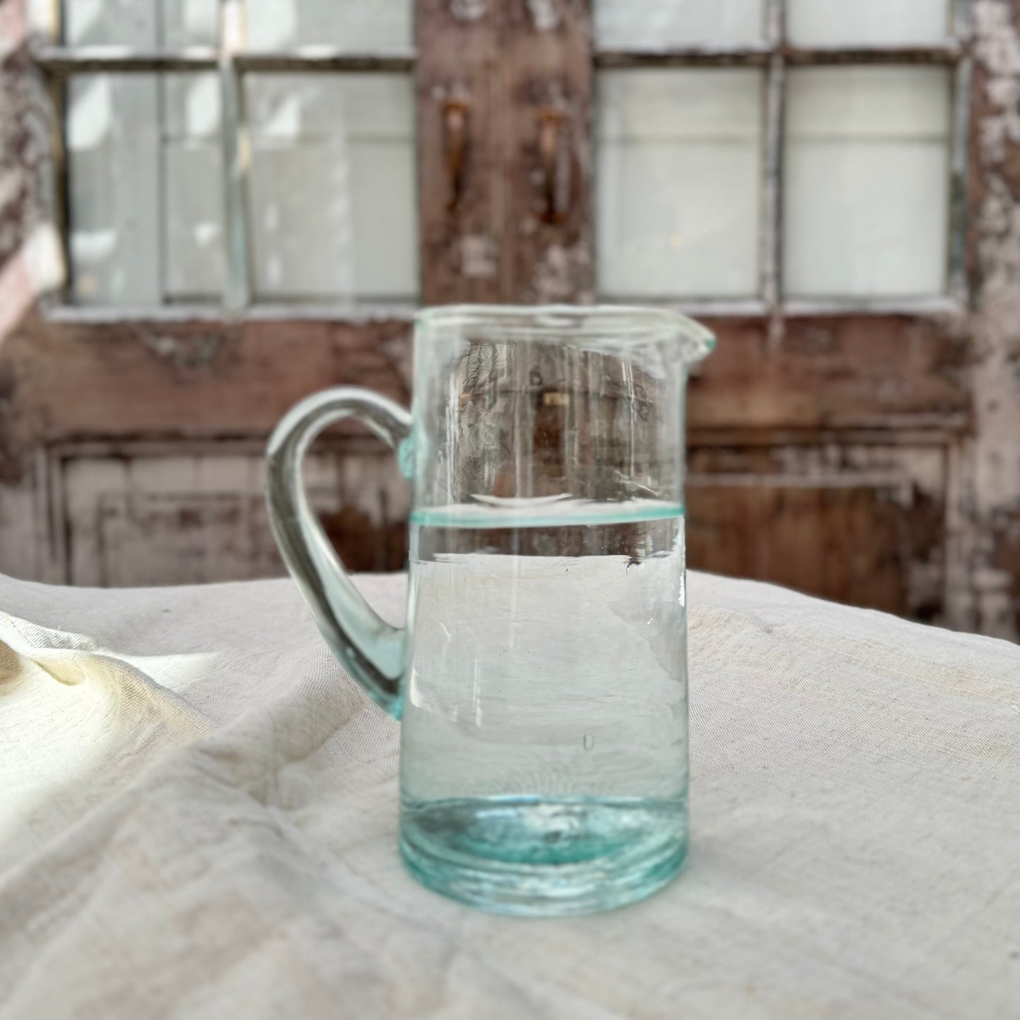 lightly green tinted recycled Moroccan glass pitcher