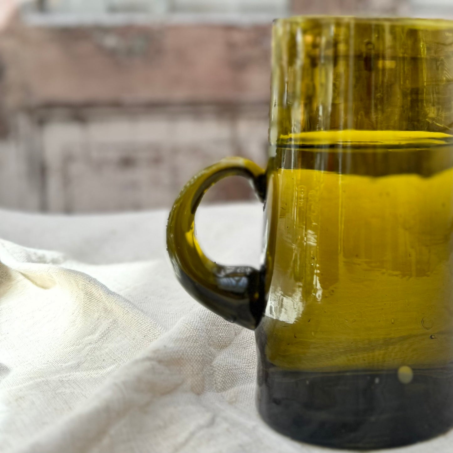 bronze colored Moroccan glass pitcher