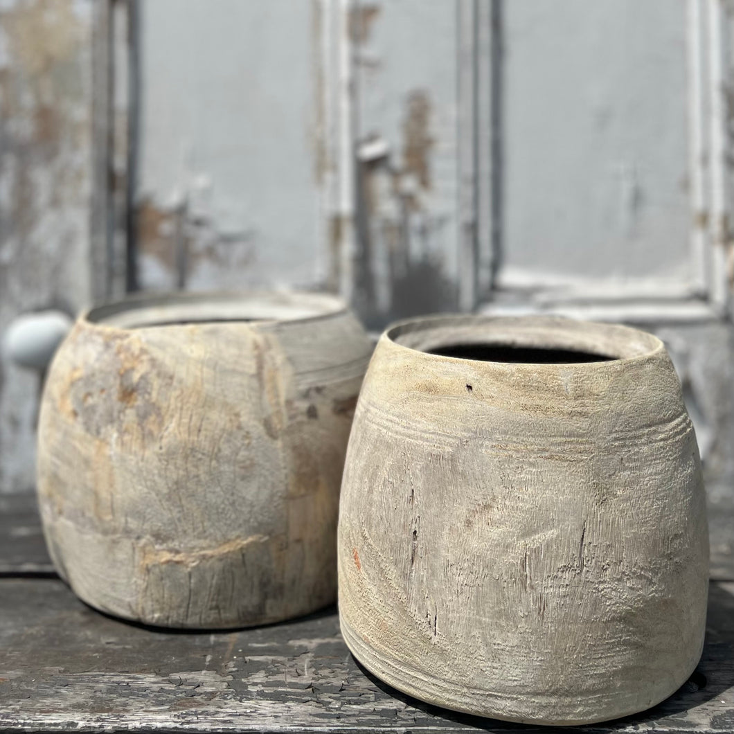 hand carved rounded wood vessel