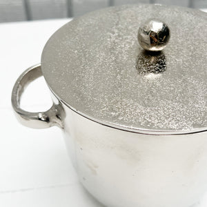 silver metal ice bucket with two handles and a lid