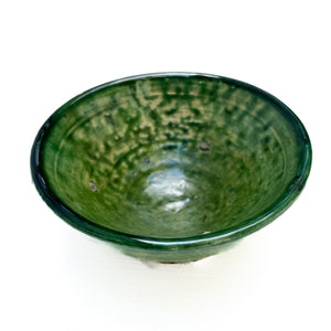 rustic ceramic handmade bowl in varying shapes and sizes with green glaze