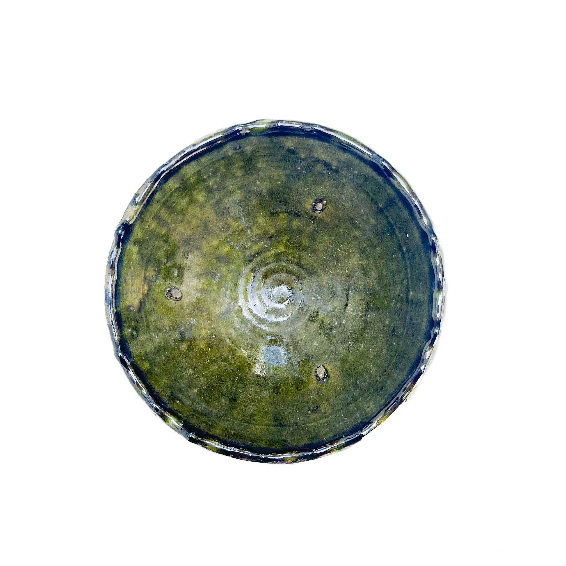 rustic ceramic handmade bowl in varying shapes and sizes with green glaze