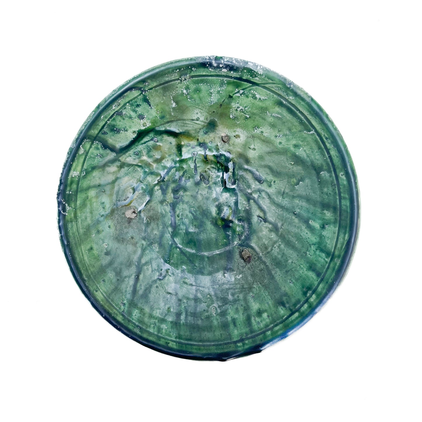 rustic ceramic handmade bowl in varying shapes and sizes with green glaze