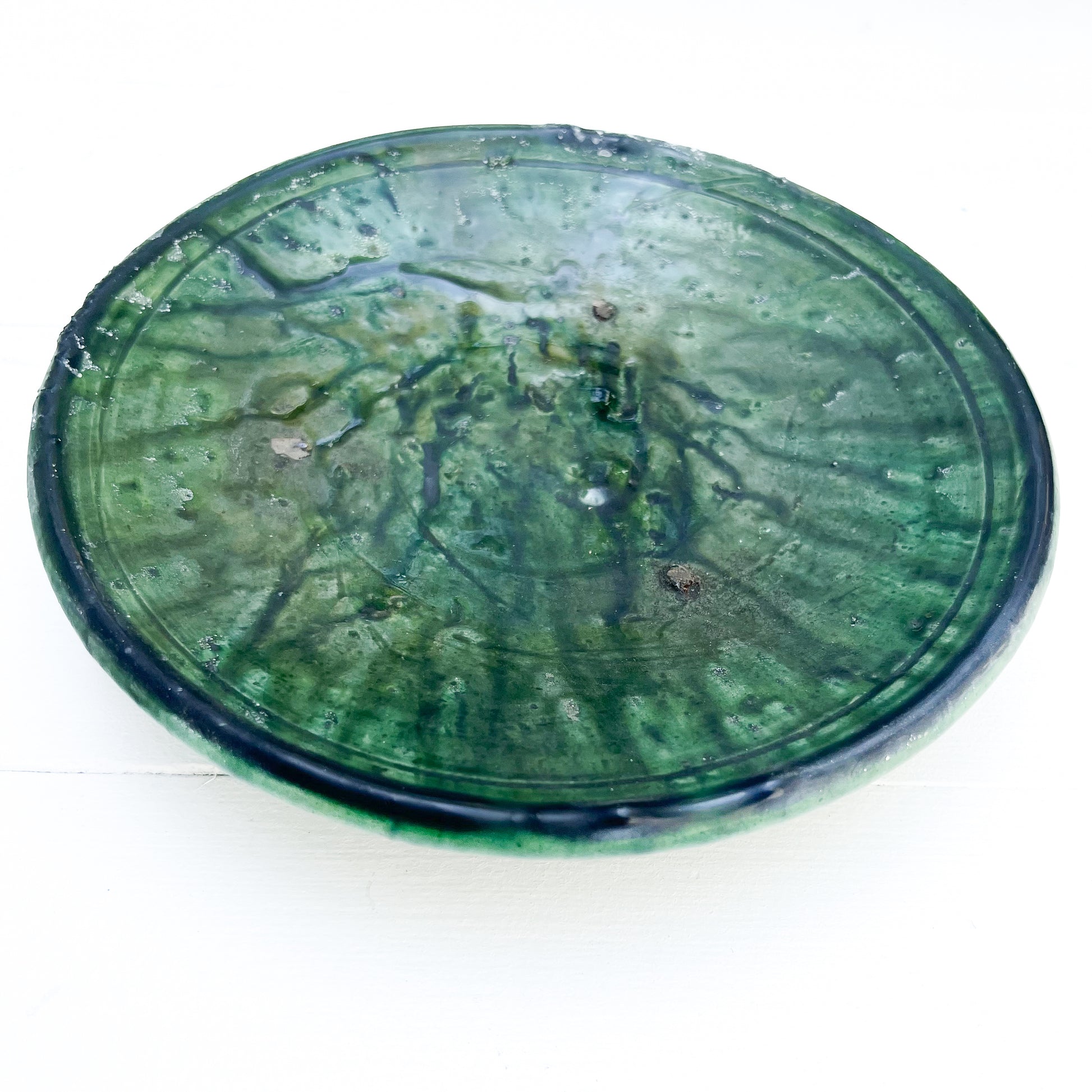 rustic ceramic handmade bowl in varying shapes and sizes with green glaze