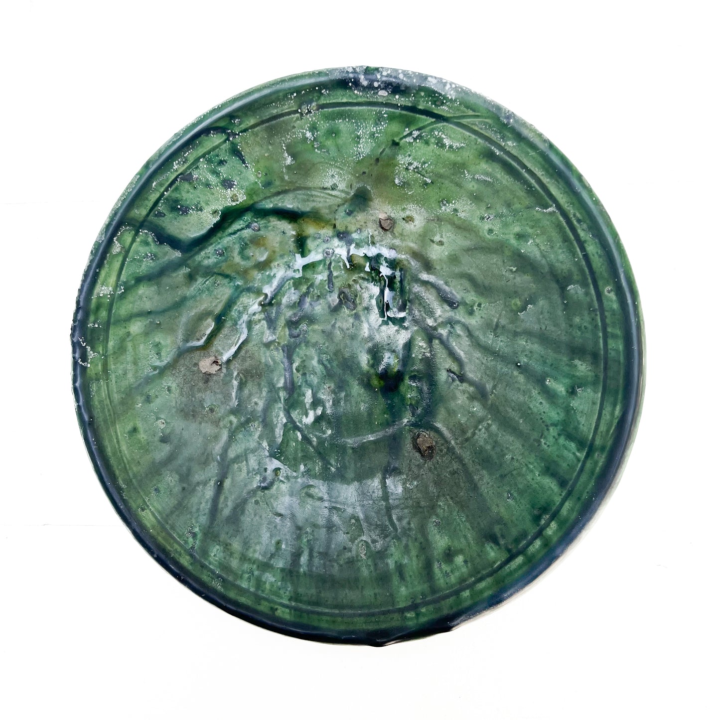rustic ceramic handmade bowl in varying shapes and sizes with green glaze